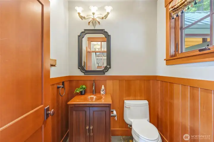 Main level bathroom with custom finishes and designer light fixtures