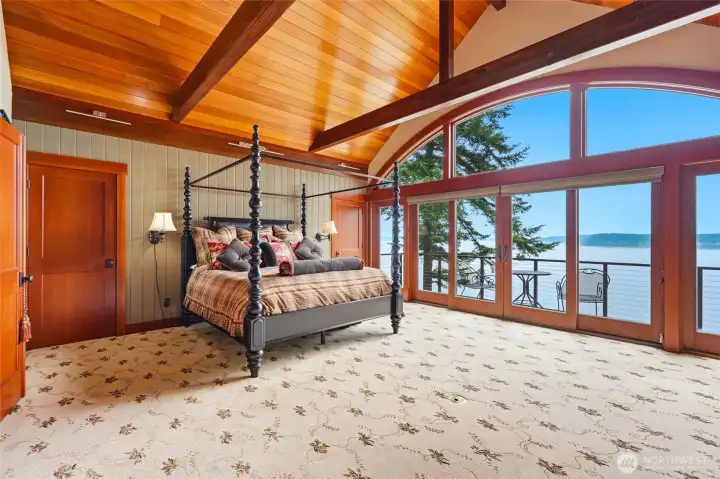 Welcome to the Primary suite featuring beautiful vaulted ceilings, stunning views of Mt Ranier and Hat Island