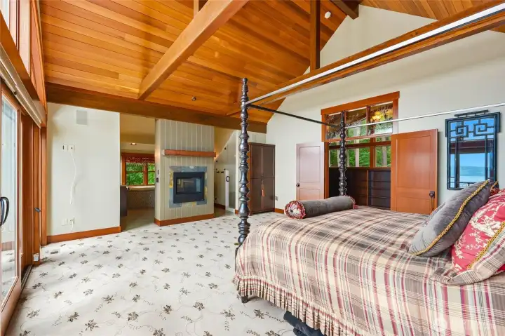 Dual sided fireplace wall that warms the primary bedroom and the bathroom suite