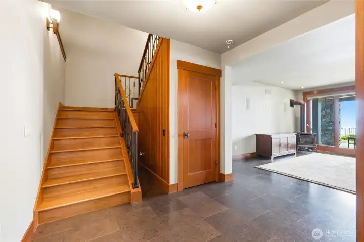 Stairs down to third floor, featuring radiant cork flooring throuhgout