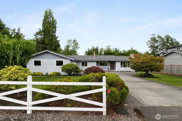 From the street, this home beautifully reflects the timeless character of the Birchwood neighborhood while blending its classic mid-century charm with today's lifestyle.