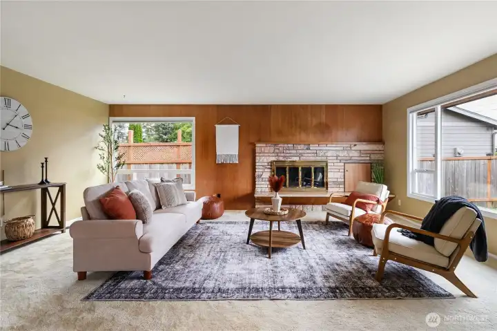 Spacious front living room with expansive windows that fill the space with an abundance of natural light.