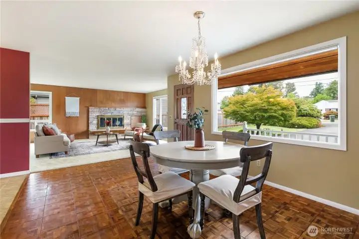 The chandelier serves as the perfect finishing touch, complementing the dining room's timeless mid-century character.
