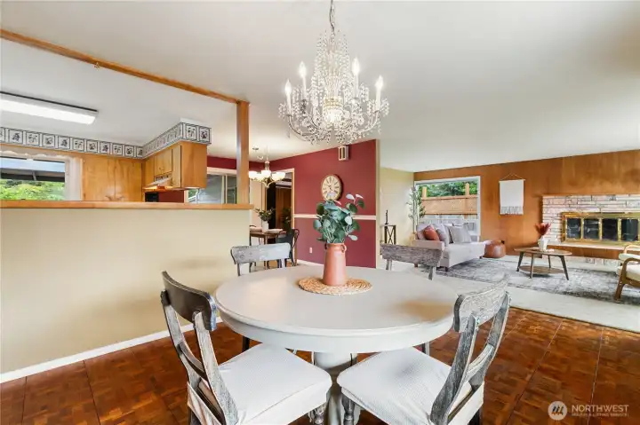 The dining room's half-wall creates an open connection to the kitchen, making it easy to gather, entertain, and stay connected with family and guests.