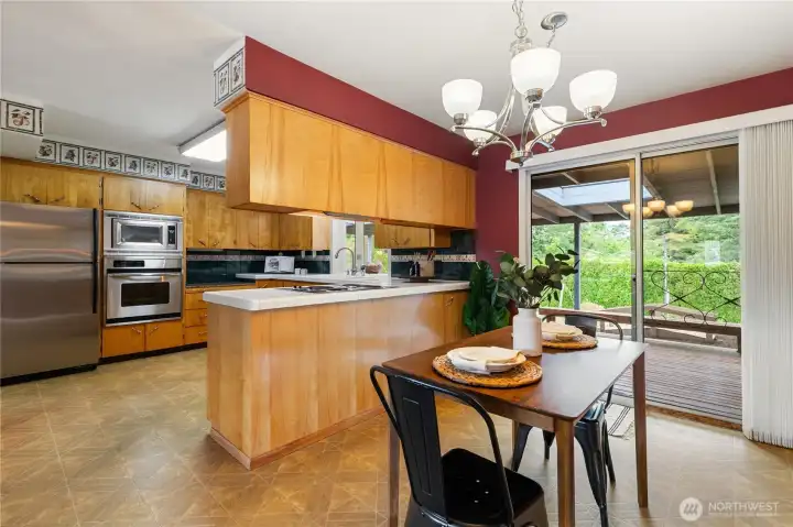 This large casual dining area off the kitchen is complemented by a separate formal dining room, offering abundant space for entertaining family and friends.