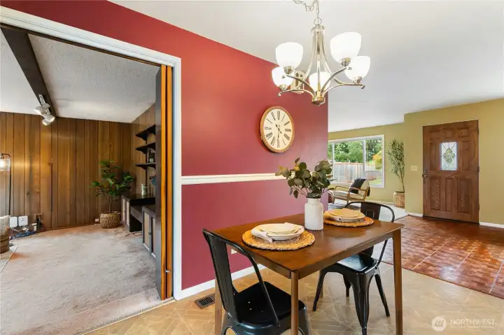 Kitchen eating area looking towards the front entrance and family room to the left.