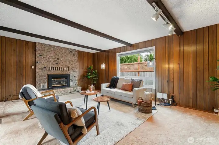 Spacious family room with a cozy gas fireplace offers the perfect place to relax, gather, and entertain.