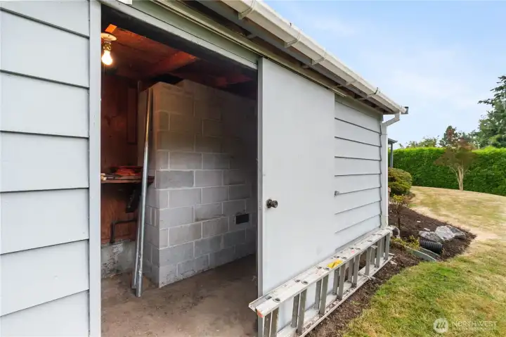 Outdoor shed provides plenty of space for all your garden tools.