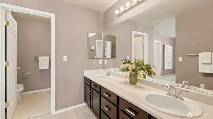 Enjoy the convenience of a spacious double vanity and a separate water closet in this bright and beautifully laid out bathroom Enjoy the convenience of a spacious double vanity and a separate water closet in this bright and beautifully laid out bathroom