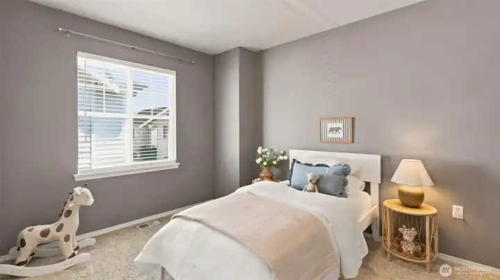 A charming and versatile third bedroom, perfect for a nursery, kid's room, or even an additional home office A charming and versatile third bedroom, perfect for a nursery, kid's room, or even an additional home office