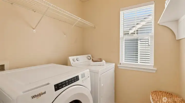 Keep things organized and out of sight in this dedicated laundry room, offering a clean, simple setup that's perfectly functional Keep things organized and out of sight in this dedicated laundry room, offering a clean, simple setup that's perfectly functional