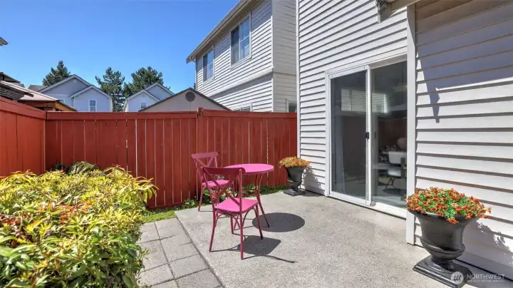 This sunny patio provides a private oasis for small get-togethers with quick access through large sliding glass doors This sunny patio provides a private oasis for small get-togethers with quick access through large sliding glass doors