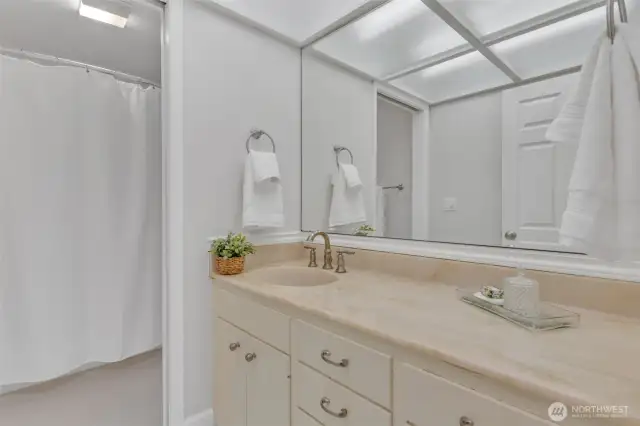 The upper level full bathroom is just around the corner from the bedrooms.