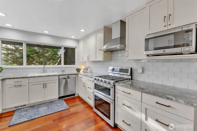 Kitchen has newer appliances and granite countertops.