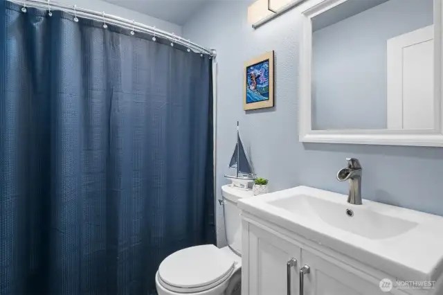 Full bathroom on main level with shower/tub combo. Photo above toilet is reserved.