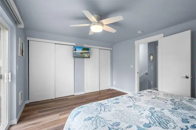 Another view of the Primary Bedroom showing the dual closets.