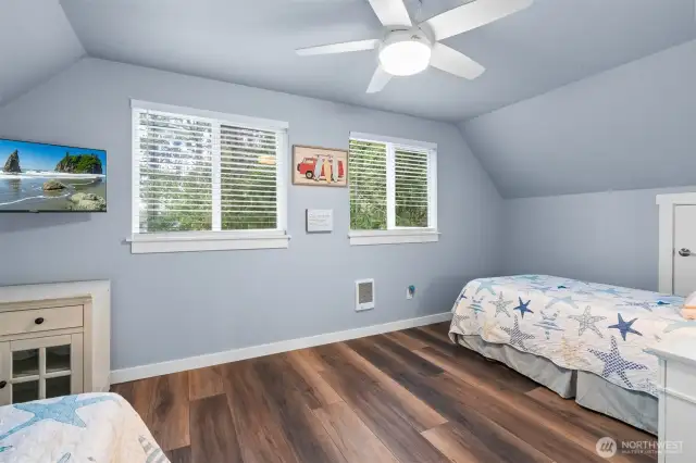 Spacious second bedroom on upper level with room enough for two beds.