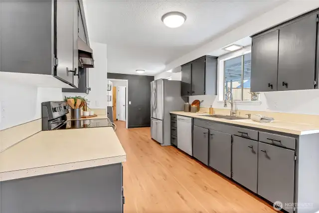 Kitchen Windows overlook Backyard