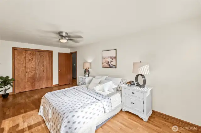 Main-level primary with natural light and walk-in closet.