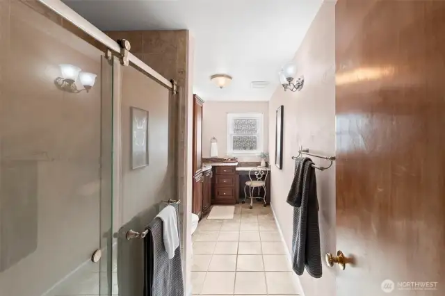 Updated ¾ bath with stylish vanity.