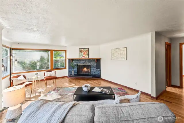 Cozy up by the classic wood-burning fireplace in the living room.