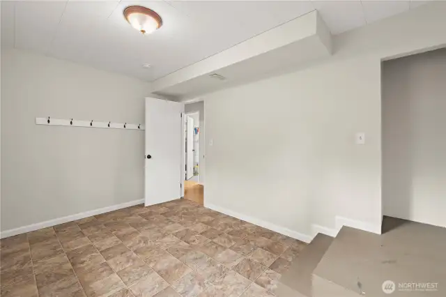 Large mudroom for your lifestyle.. Gym? Drop Zone? Access to garage from here