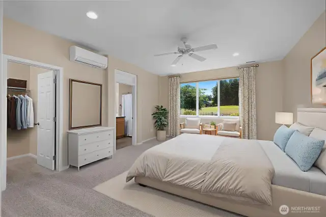 Stunning large primary bedroom with ductless air and a territorial view.