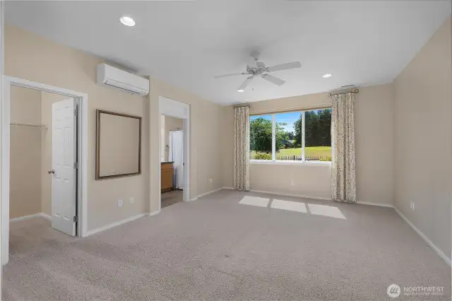 Stunning large primary bedroom with ductless air and a territorial view.