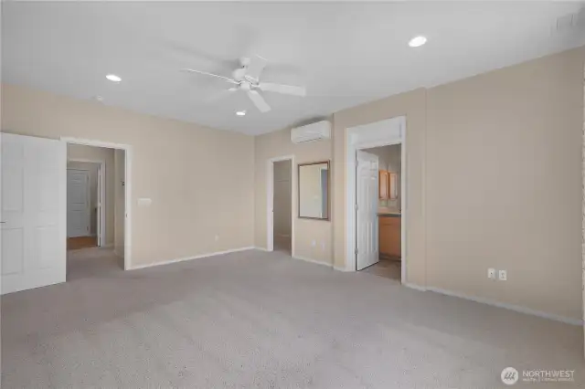 Stunning large primary bedroom with ductless air and a territorial view.