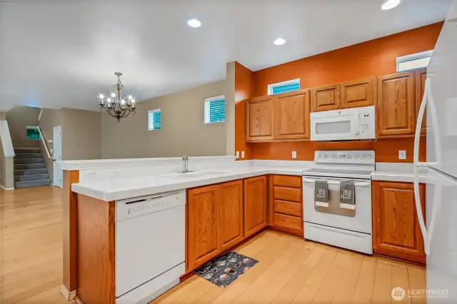 The kitchen boasts a plethora of cabinets and plenty of counter space. Fridge and washer/dryer stay!
