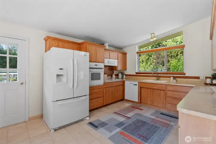 All appliances stay and check out the counterspace! Also has space for informal dining.