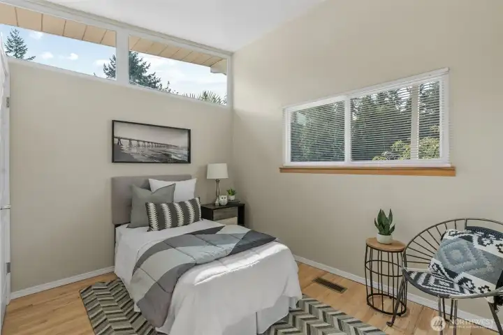 Main level bedroom is filled with natural light and is just steps from the updated main hall bath.