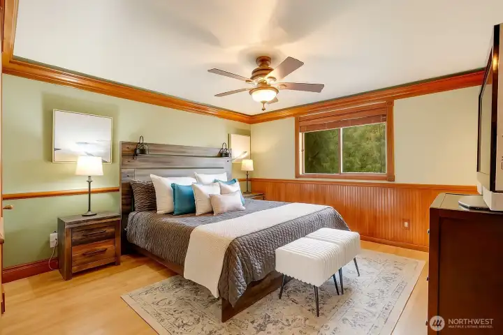 Upstairs, the primary suite serves as a private retreat, complete with its own ensuite bath.