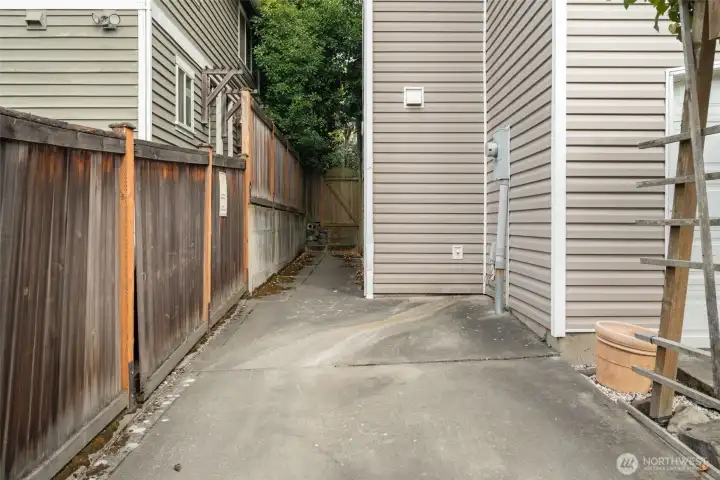 Dedicated parking spot off alley.