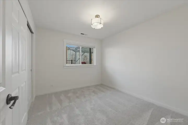 Additional upper-level bedroom with brand new carpet, cordless blackout blinds and updated closet doors and hardware for a clean, modern feel.