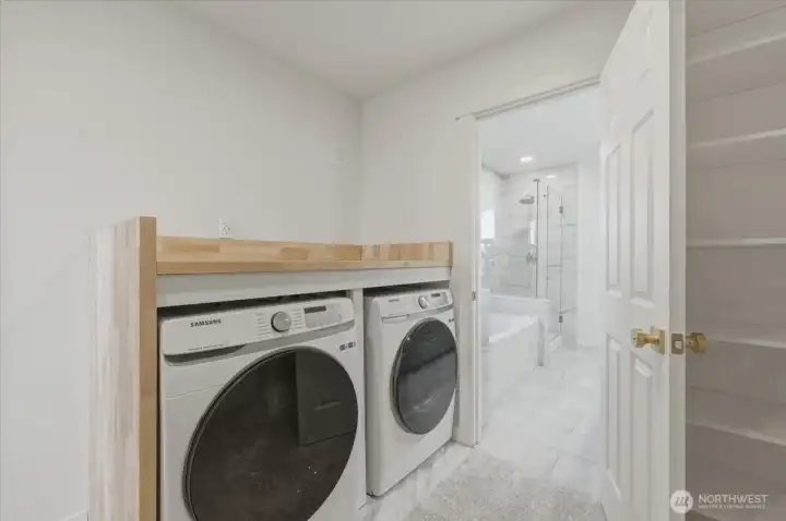 Laundry day just got easier with a full-size washer and dryer perfectly tucked into the primary suite closet.