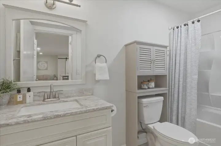 Full bathroom with quartz counters, making the lower level a truly independent living suite.