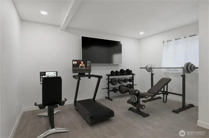 Versatile lower-level bonus room with closet -- adaptable for home office, gym, hobby space or small business setup. Virtually staged for inspiration.