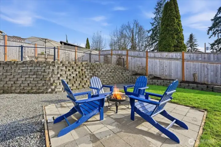 One of many gathering spots on the property! Backyard is fully fenced.