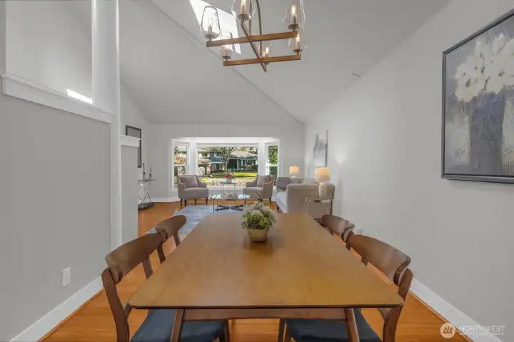 Open-concept dining area flowing into the living room