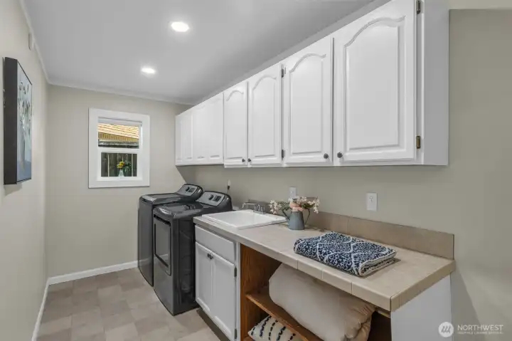 Spacious laundry room with storage on main floor