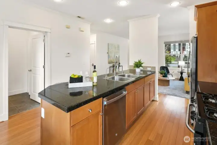 Sleek granite meets warm wood. This kitchen is ready for those local ingredients from Columbia City Farmers Market