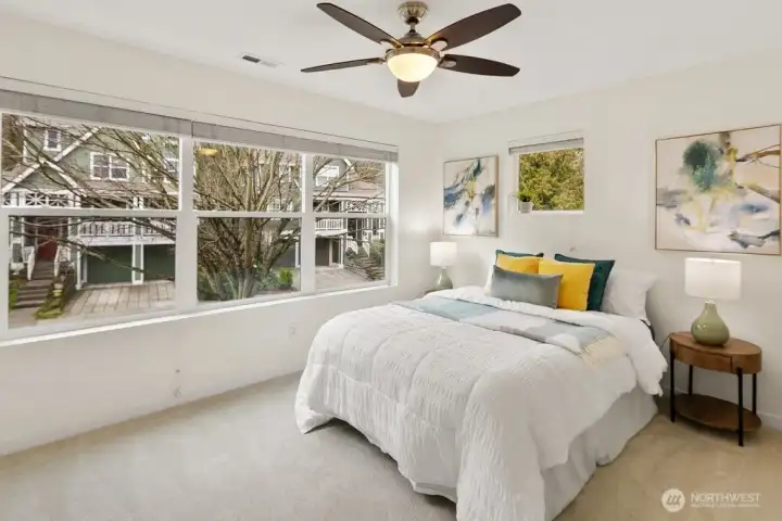 This spacious West-facing spare bedroom is flooded with afternoon light, making it an ideal second suite,with plenty of room to spread out.