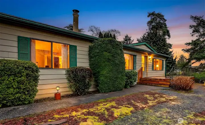 Front of home overlooking Reflection Lake to the southwest for great year round light.   Twilight photo is virtually staged.