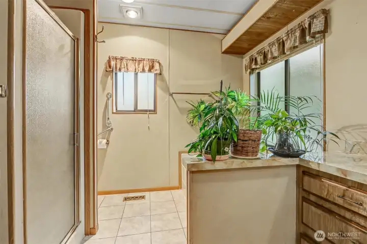 Master bedroom suite with a double walk in closet and 5 piece bathroom overlooks the lake.