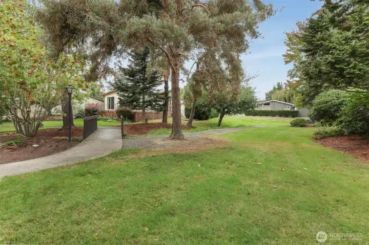 South side of the home boarders a community trail, greenbelt and creek for a very private natural setting.