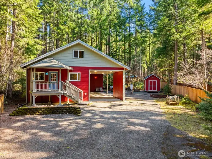Level property with 2 RV hookups, storage shed, firepit, covered spaces, gardening, and so much more!