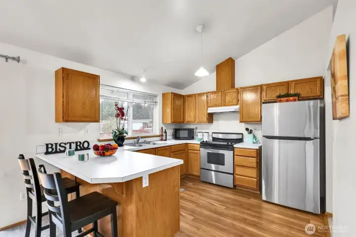 Well laid out kitchen with eat-in bar.