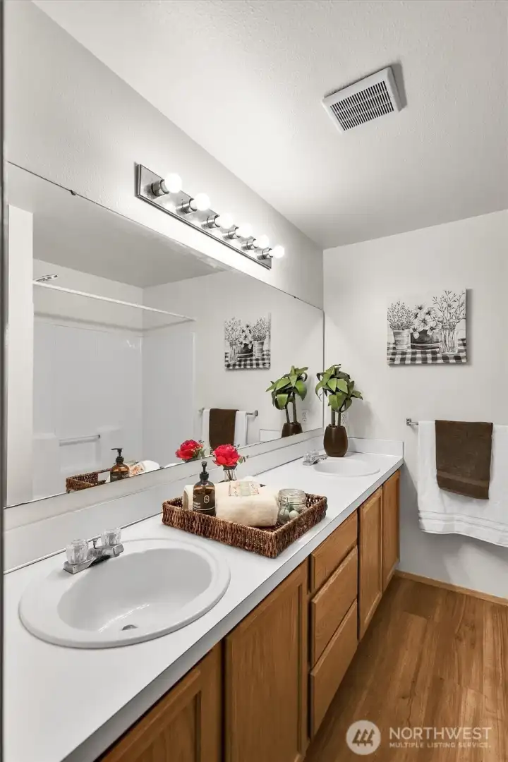 Full en-suite bathroom with double vanity.