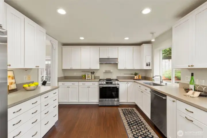 Updated Kitchen with quartz counters and stainless appliances including new dual fuel oven/range!